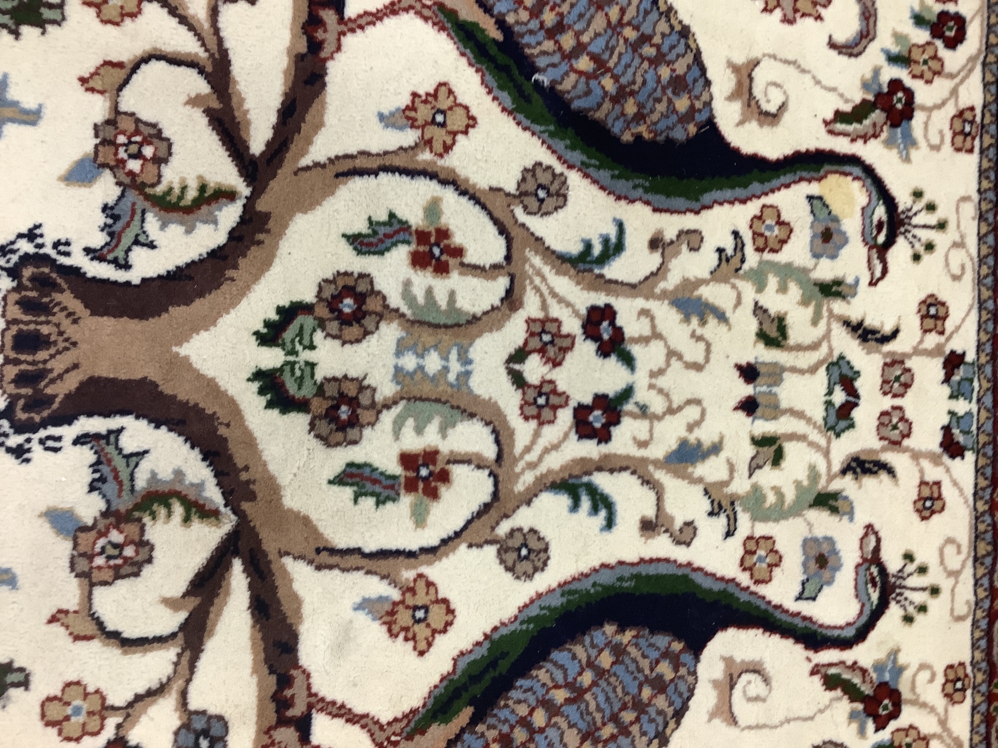 A Tabriz ivory ground 'Peacock' rug, 122 x 120cm